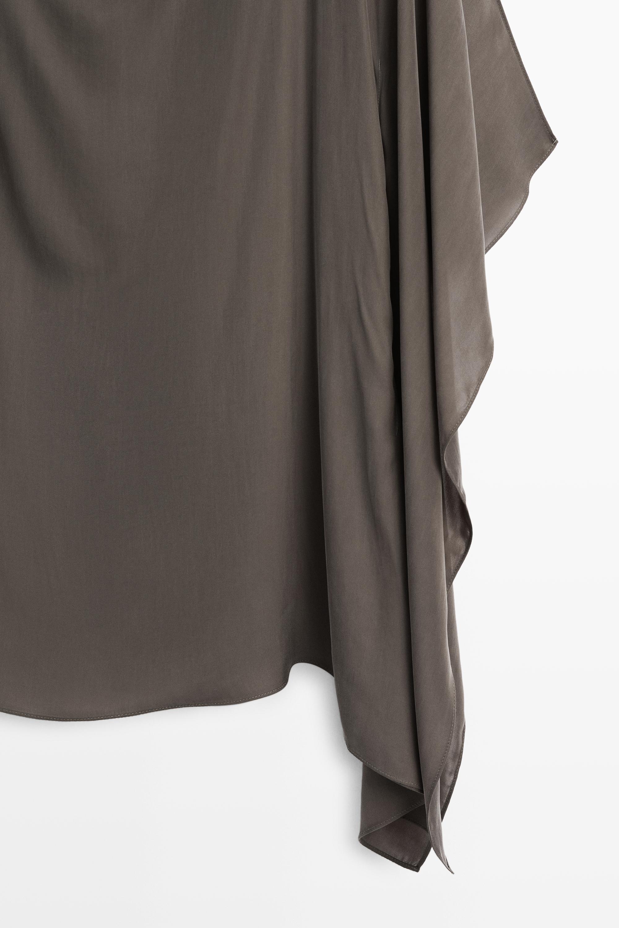 Asymmetric flowing cape top